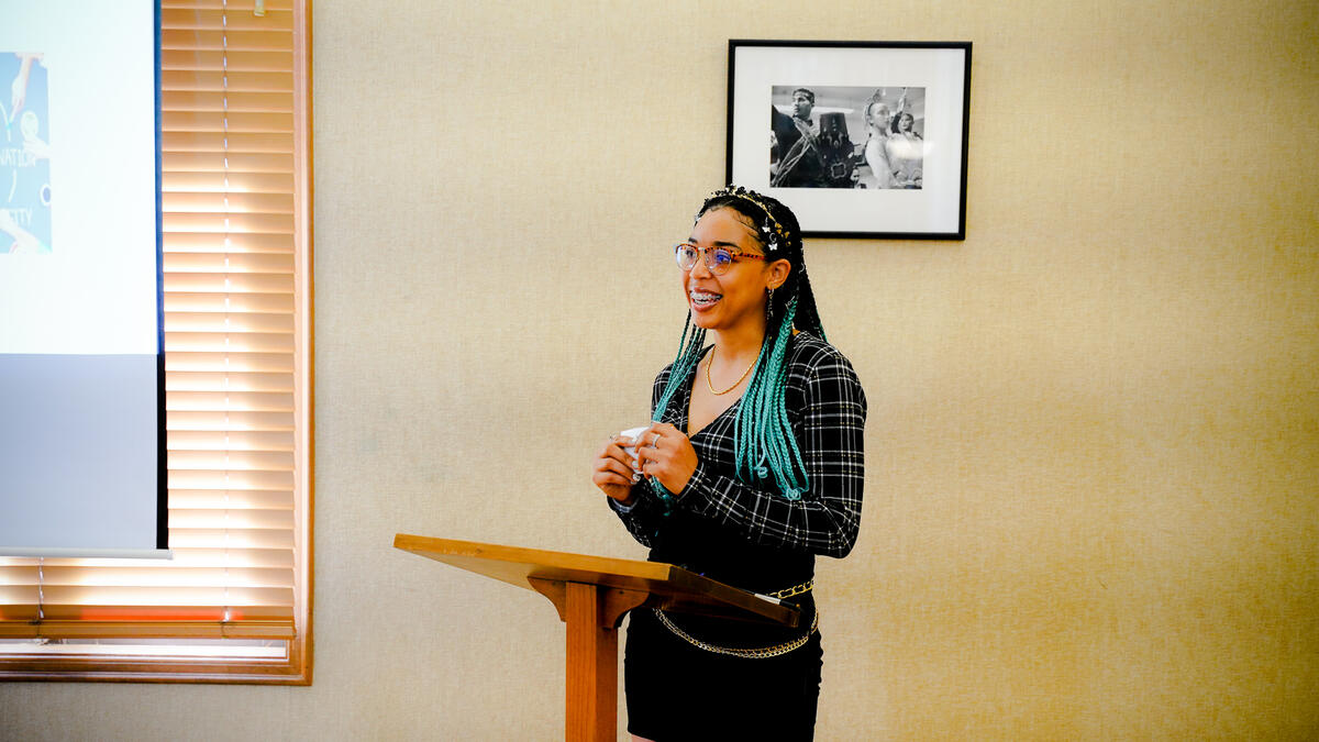 Student Crystal Swan presents to her cohort her research on a historical example of an Afro-centric curriculum based school and its impact on its students in the Bay Area. Her focus was the Black Panther Party’s Oakland Community School (active 1973-1982)