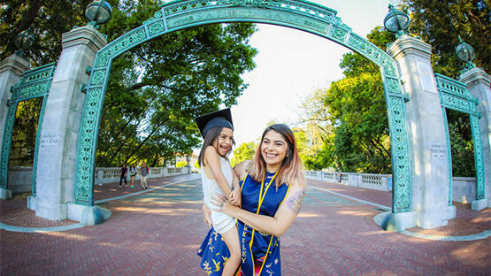 Student parent with her daughter at Sather Gate